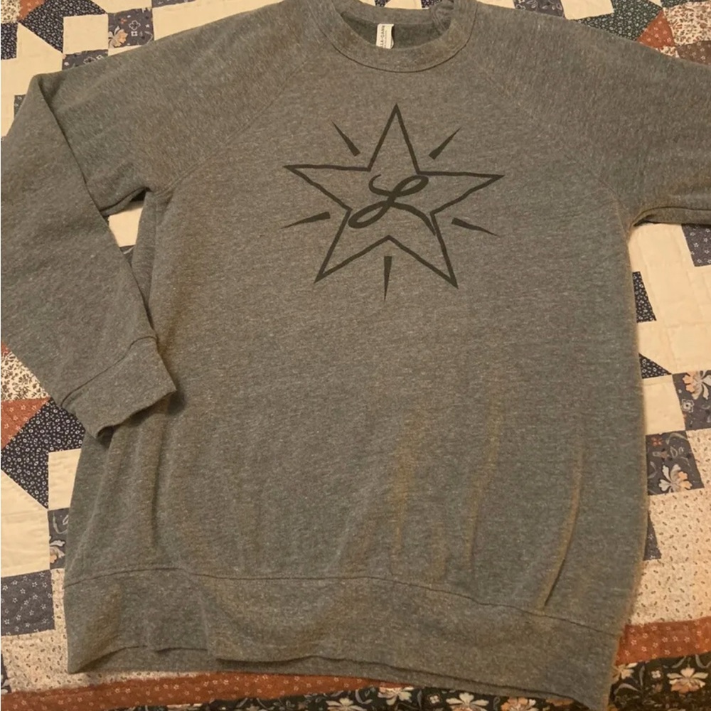 Lucero (the band) sweater. Size large but feels like a small.